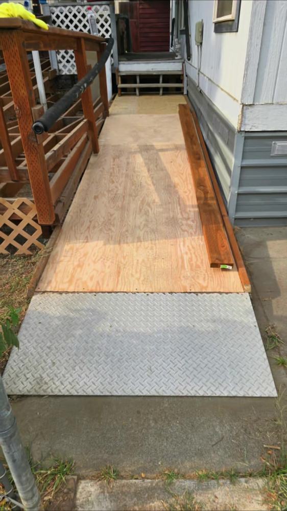 Wood entry ramp Speedy's built so an elderly couple could get into their home safely