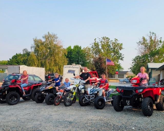 James Hoidal and his family lined up on their ATVs and dirt bikes
