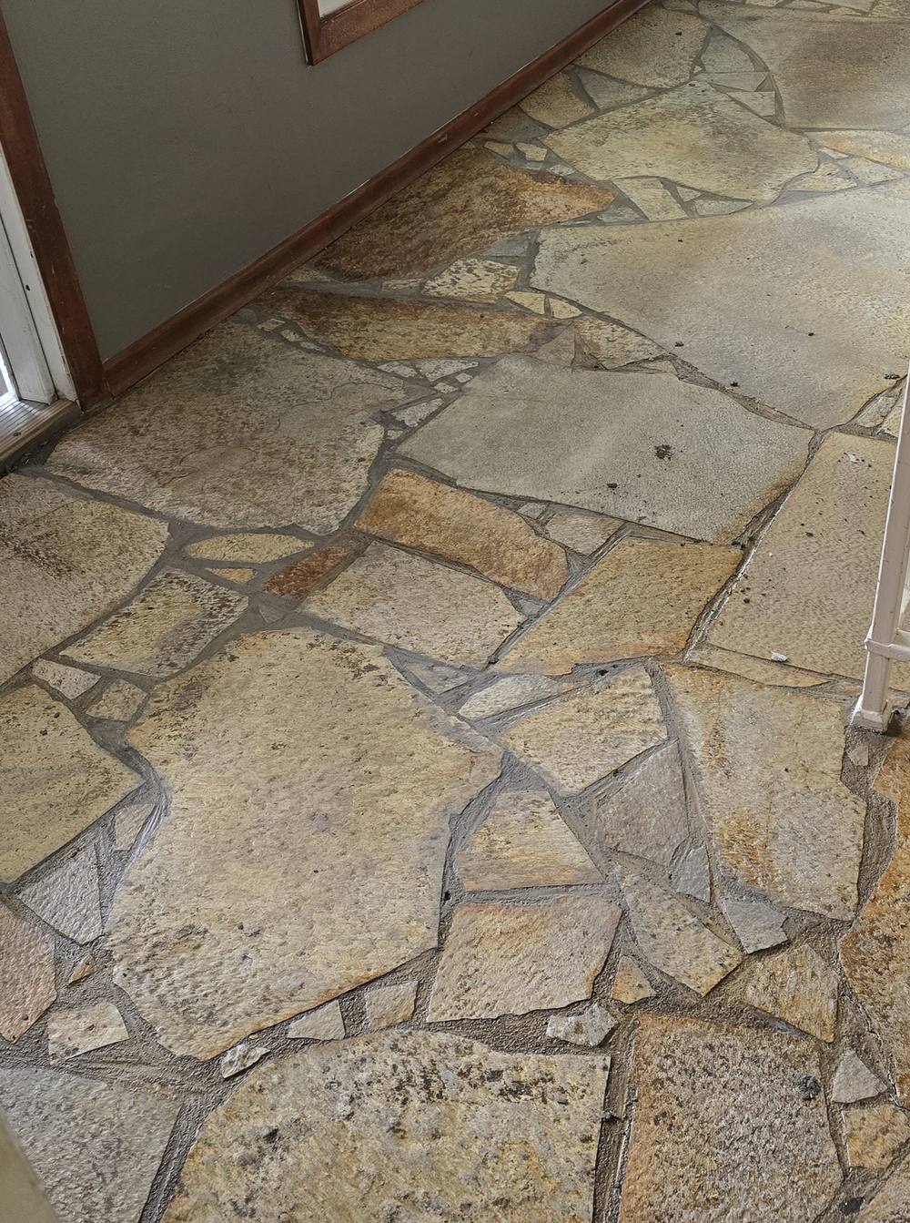 Flagstone entry cleaned up during a market-ready refresh on a vacant house