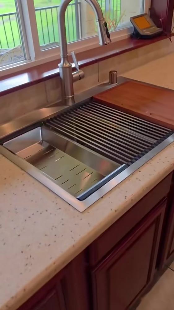 New stainless kitchen sink set in the countertop (a licensed plumber made the hookups)